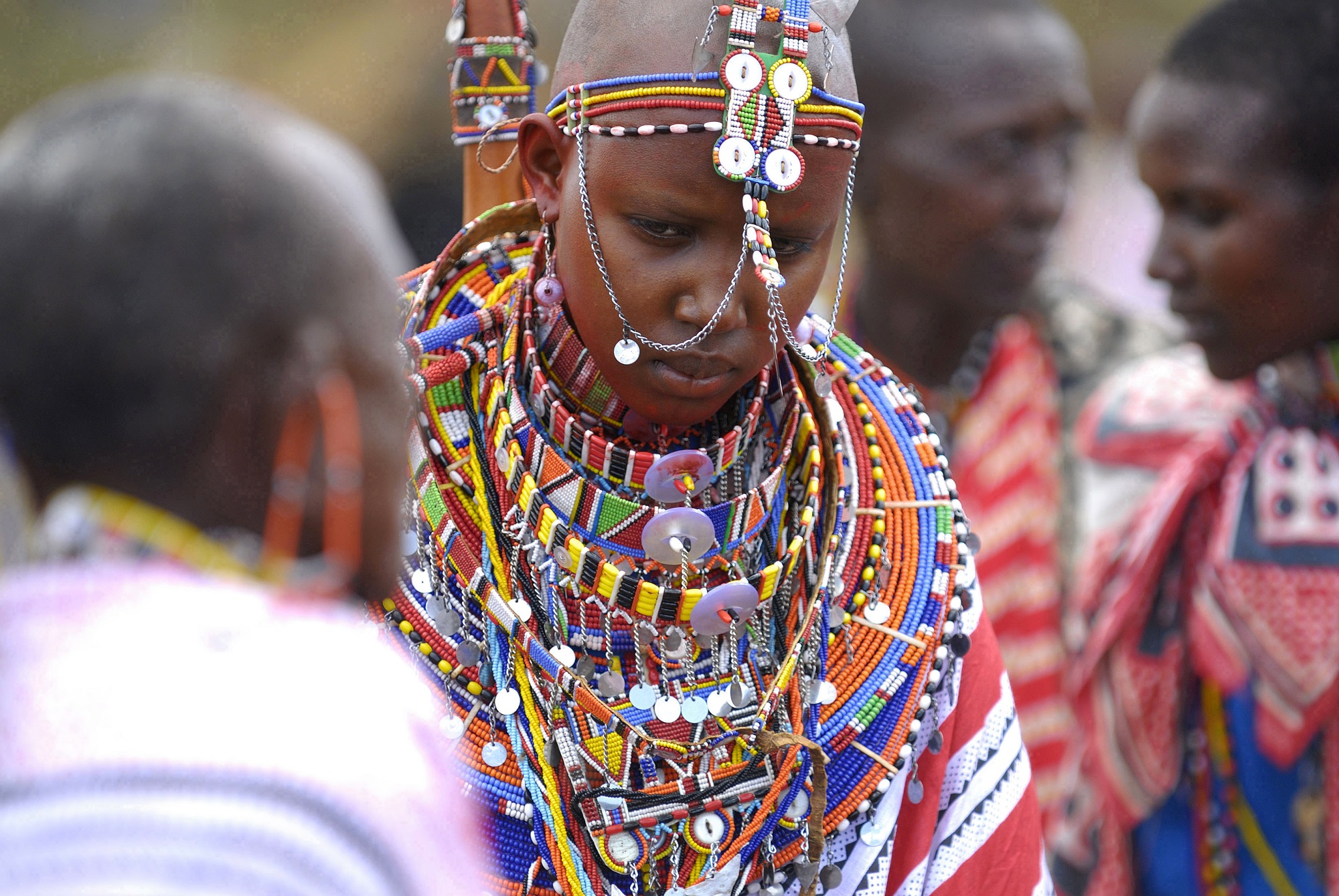 Maasai bride Namunyak Baiera wears traditional bead necklaces during her wedding in Olepolos village, 120 km (74 miles) southeast Nairobi, March 31, 2007. In the Maasai tradition the groom has to pay for his bride in cows and sheep, which have to be brought to her family on the wedding day. REUTERS/Damien Guerchois (KENYA) - RTR1ODTF